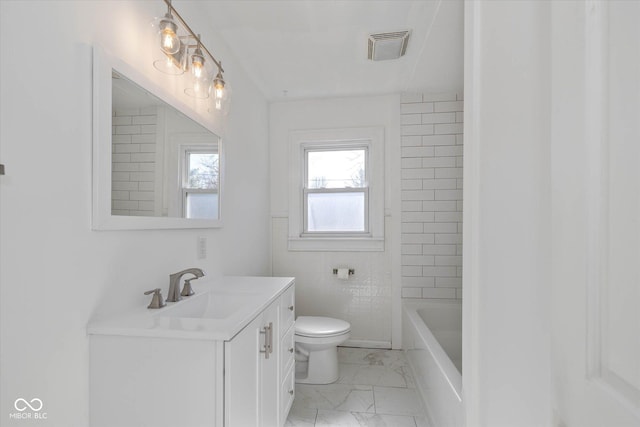 bathroom with vanity and toilet