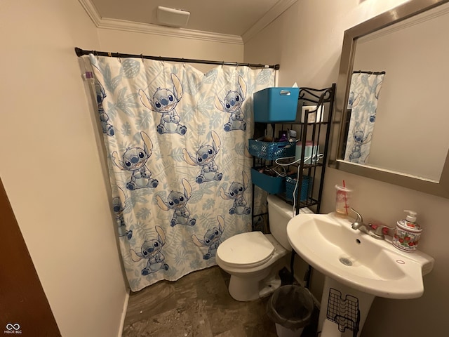 bathroom with crown molding, sink, and toilet