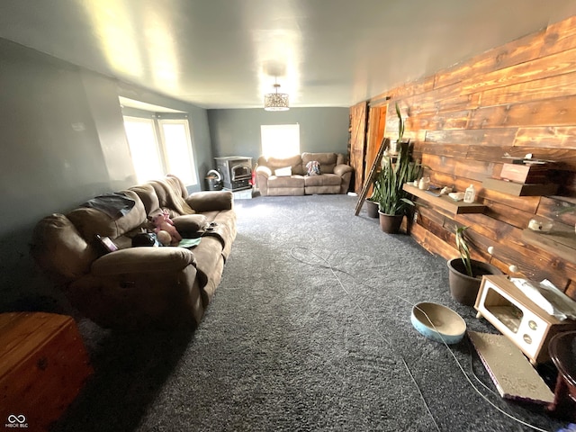 living room featuring wood walls and carpet flooring