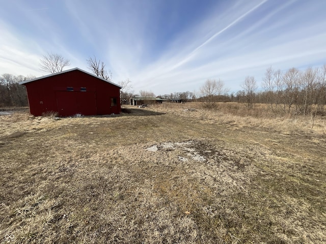 view of yard with a rural view