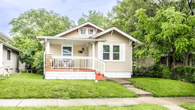 361 S Spencer Ave, Indianapolis, IN 46219 - bungalow-style house with covered porch and a front yard