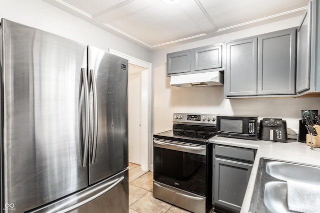 361 S Spencer Ave, Indianapolis, IN 46219 - kitchen featuring stainless steel appliances, under cabinet range hood, gray cabinetry, and light countertops