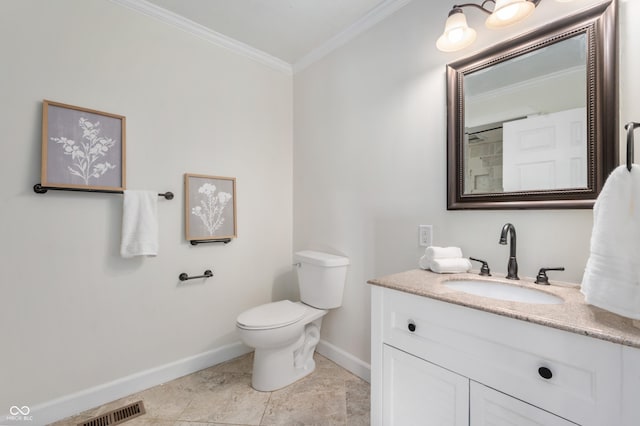 bathroom featuring tile patterned flooring, crown molding, vanity, and toilet