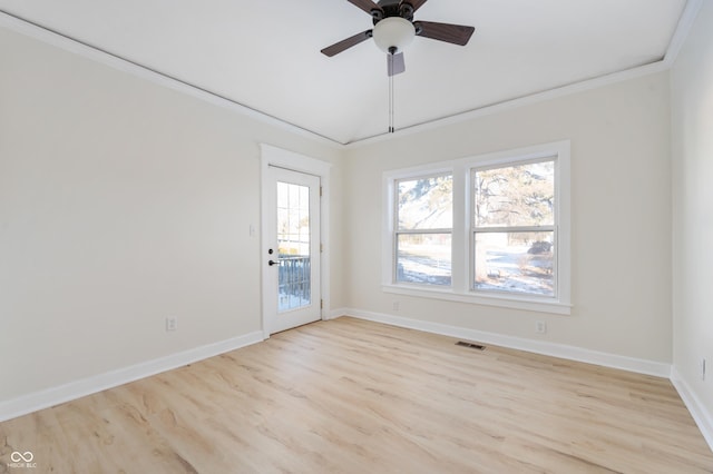 spare room featuring crown molding, ceiling fan, and light hardwood / wood-style flooring