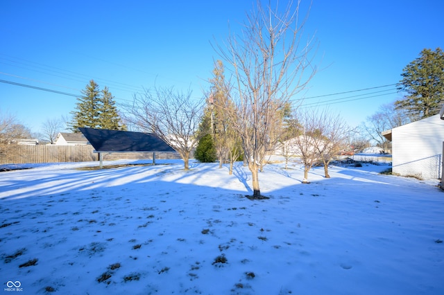 view of yard layered in snow