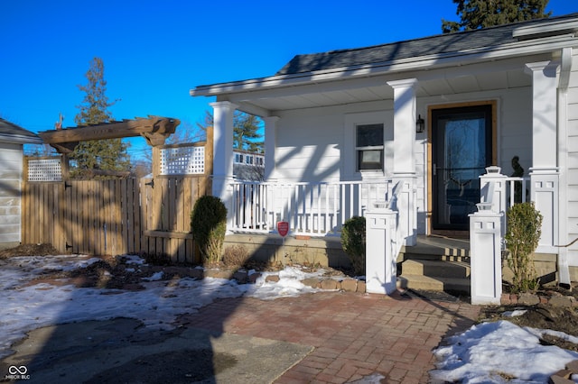 view of snow covered property entrance