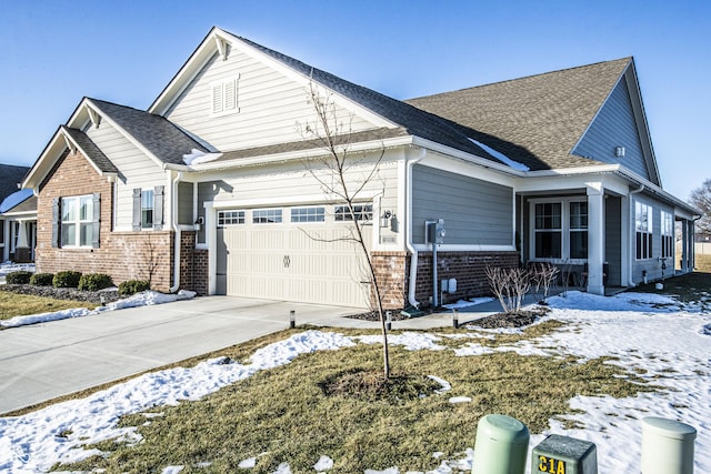 view of snow covered exterior featuring a garage