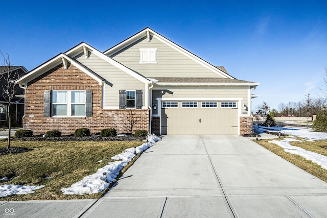 view of front of property featuring a garage and a front yard