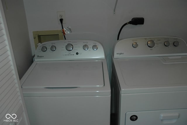 laundry area with independent washer and dryer