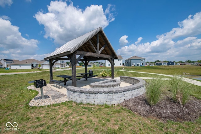 view of property's community featuring a yard and a gazebo