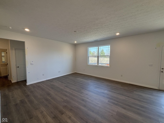 unfurnished room featuring recessed lighting, baseboards, a textured ceiling, and dark wood-style flooring