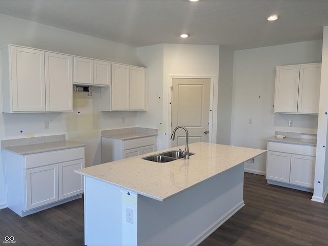 kitchen featuring white cabinetry, recessed lighting, a kitchen island with sink, and a sink