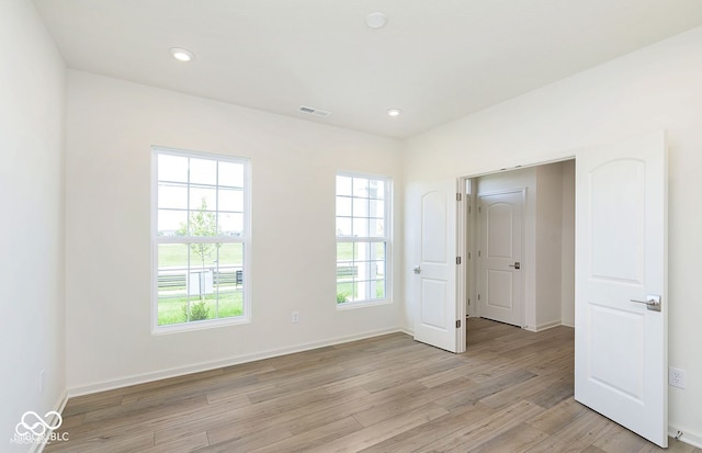 unfurnished bedroom with light hardwood / wood-style floors