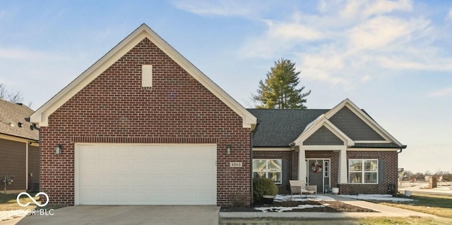 view of front of house with concrete driveway, brick siding, and an attached garage