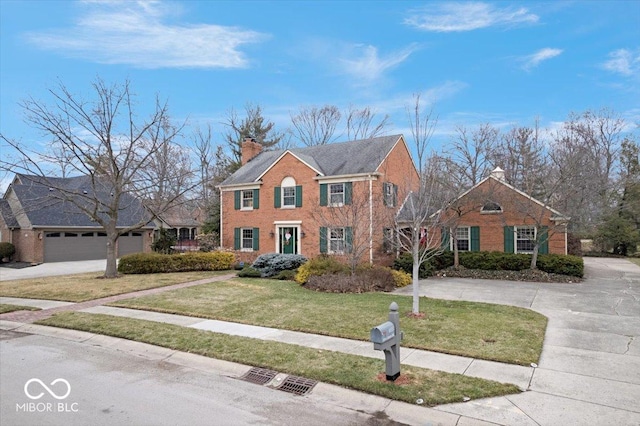 view of front of house with a garage and a front lawn