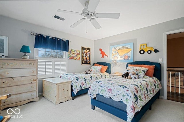 carpeted bedroom featuring ceiling fan