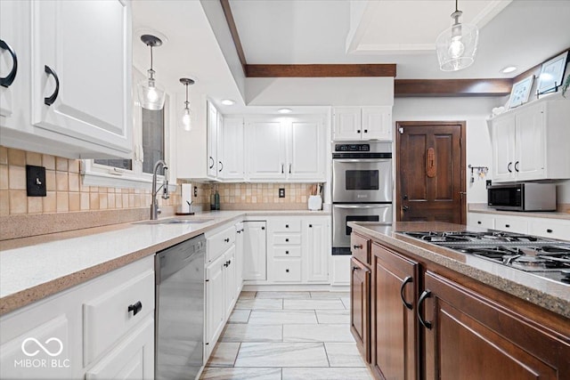 kitchen with white cabinetry, sink, and appliances with stainless steel finishes