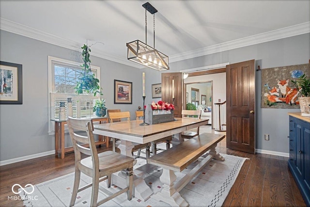 dining room with crown molding and dark hardwood / wood-style floors