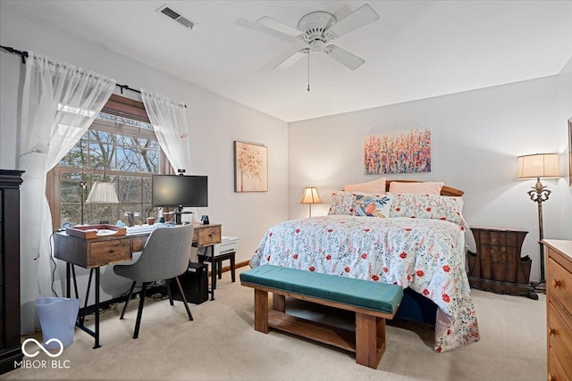 bedroom featuring light carpet and ceiling fan