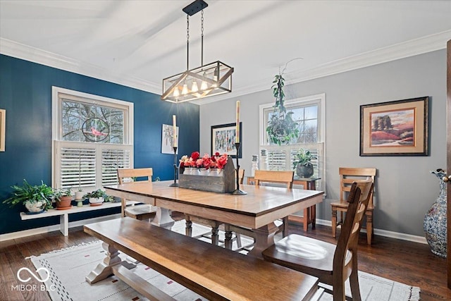 dining room featuring ornamental molding and dark hardwood / wood-style floors