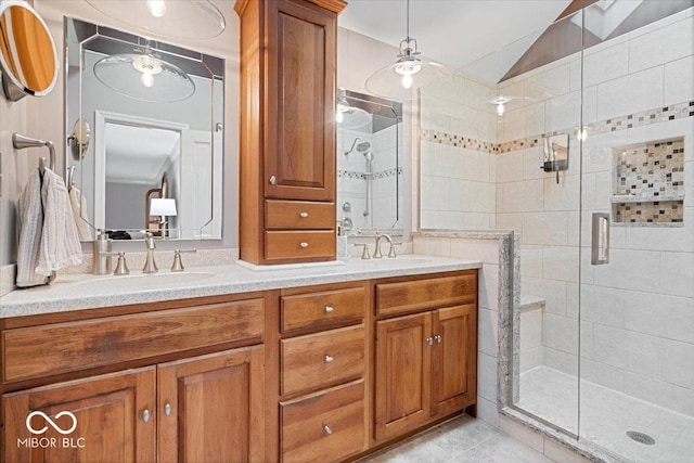 bathroom featuring vanity, tile patterned flooring, vaulted ceiling, and walk in shower