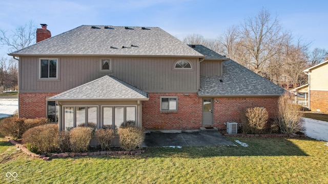 rear view of property with central AC, a patio, a sunroom, and a lawn