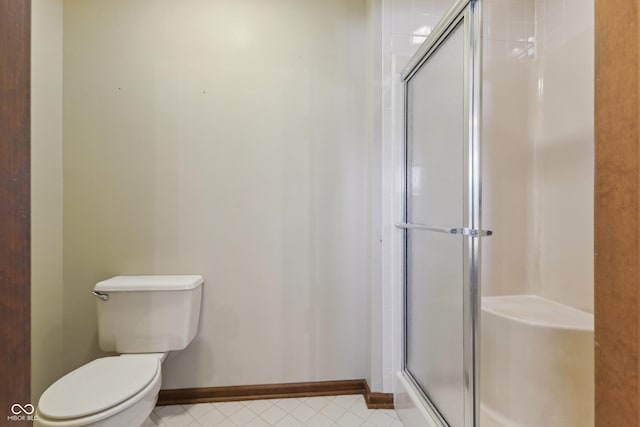 bathroom with toilet and walk in shower