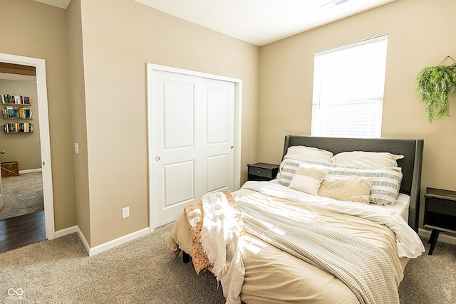 carpeted bedroom with a closet