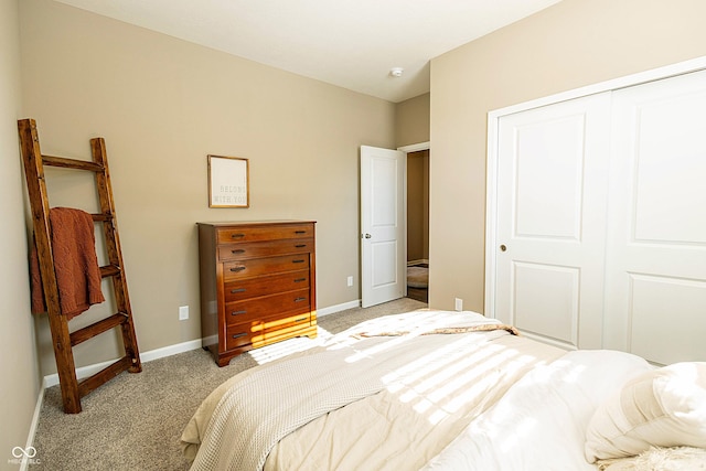 bedroom with light colored carpet and a closet