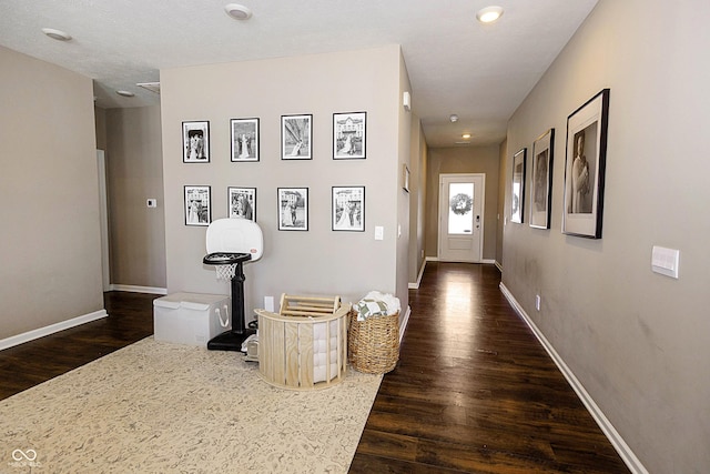 corridor with dark wood-type flooring