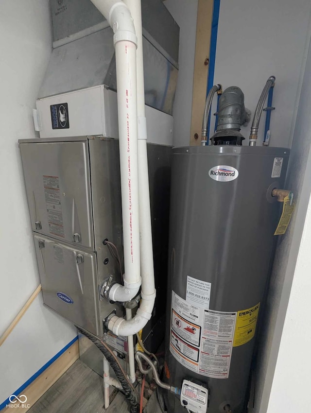 utility room featuring gas water heater