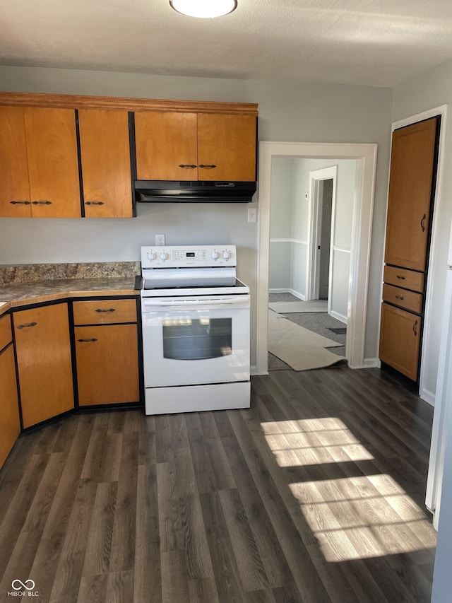 kitchen featuring dark hardwood / wood-style floors, a textured ceiling, and white range with electric stovetop