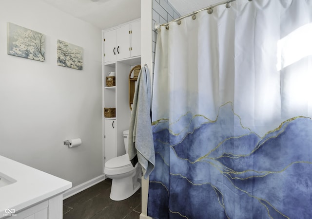 bathroom with vanity and toilet