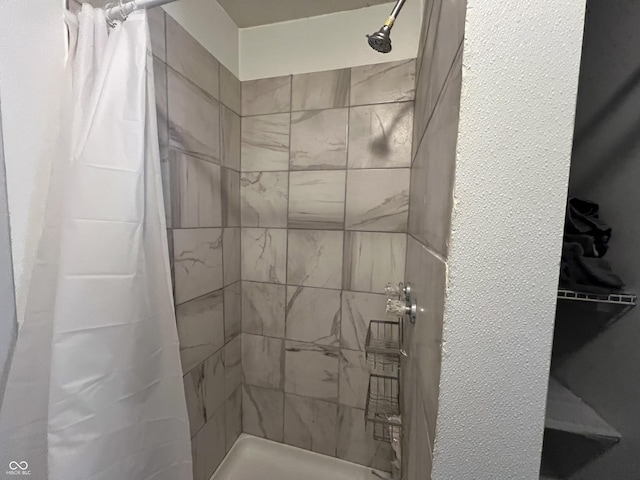 bathroom featuring curtained shower