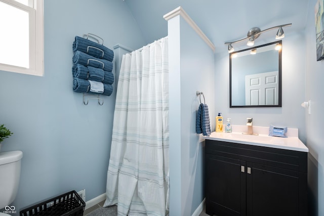 1130 S Senate Ave, Indianapolis, IN 46225 - bathroom with walk in shower, vanity, and toilet