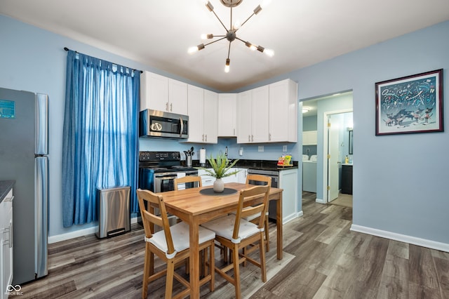 1130 S Senate Ave, Indianapolis, IN 46225 - kitchen with stainless steel appliances, white cabinetry, and dark wood-type flooring