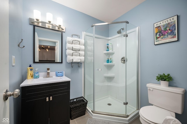 1130 S Senate Ave, Indianapolis, IN 46225 - bathroom with vanity, tile patterned flooring, a shower with shower door, and toilet