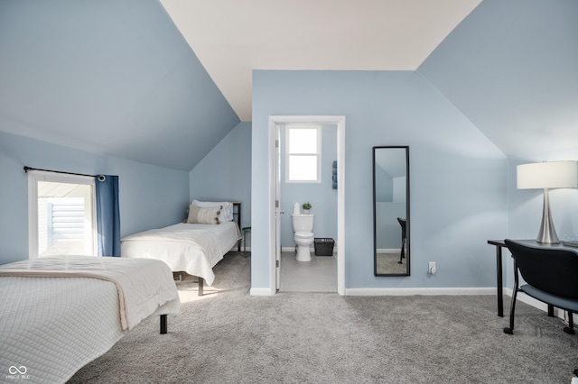 1130 S Senate Ave, Indianapolis, IN 46225 - carpeted bedroom with connected bathroom and vaulted ceiling