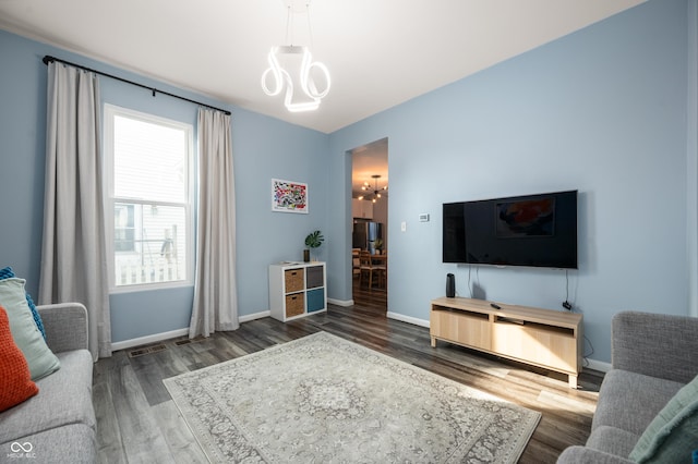 1130 S Senate Ave, Indianapolis, IN 46225 - living room featuring dark hardwood / wood-style flooring and a chandelier