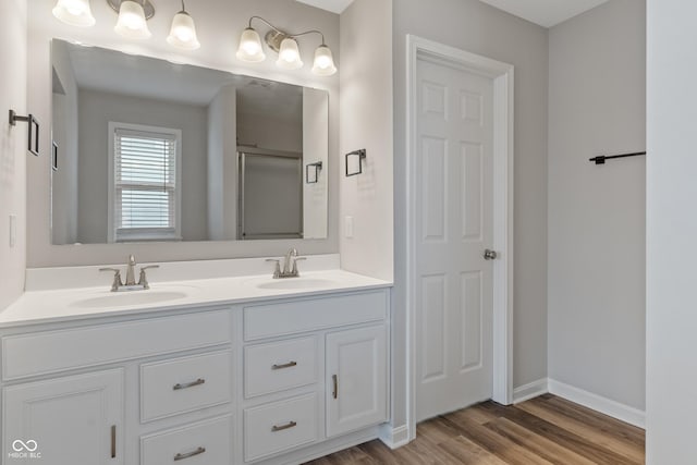 bathroom featuring vanity and hardwood / wood-style floors