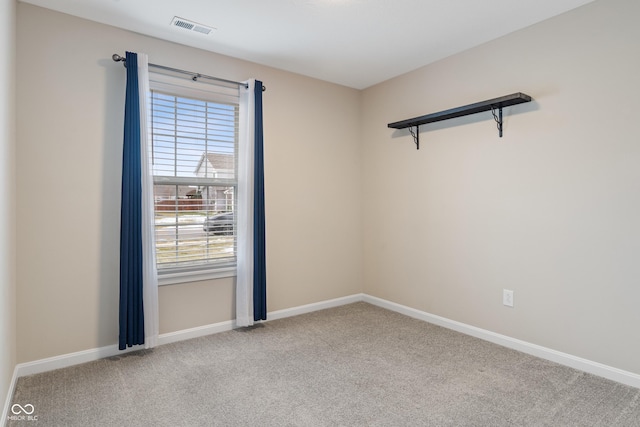 unfurnished room with light colored carpet