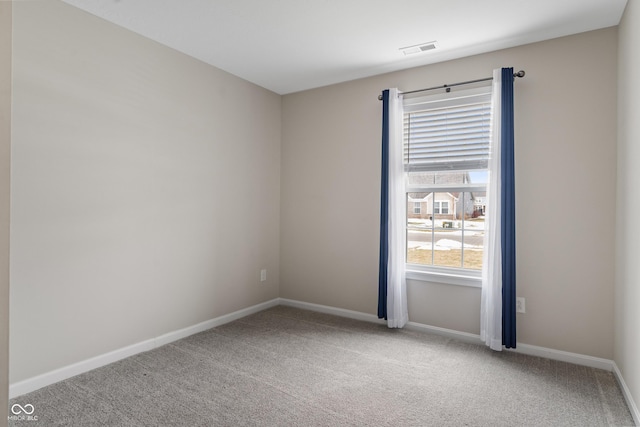 spare room featuring carpet floors