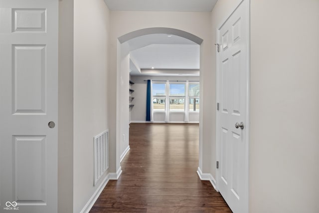 corridor featuring dark hardwood / wood-style floors