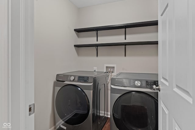 laundry room with washer and clothes dryer