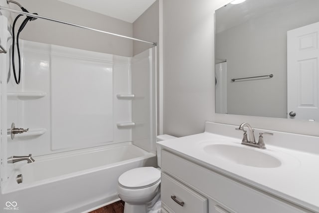 full bathroom featuring vanity, toilet, and  shower combination