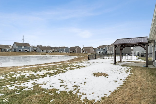 yard covered in snow with a gazebo