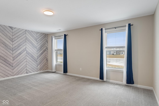 empty room featuring light colored carpet