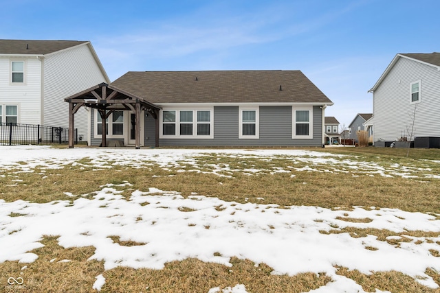 snow covered property with a gazebo