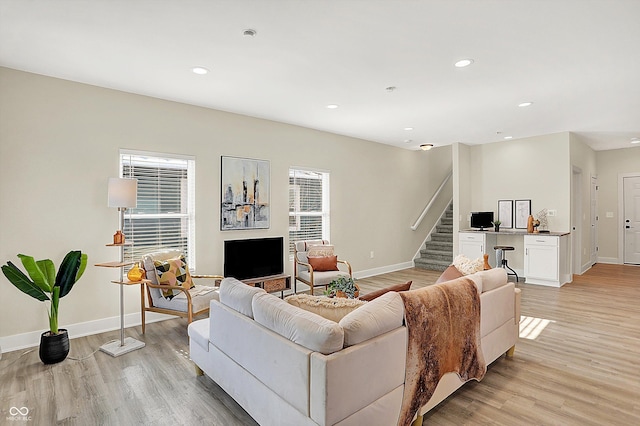 living room with a healthy amount of sunlight and light wood-type flooring