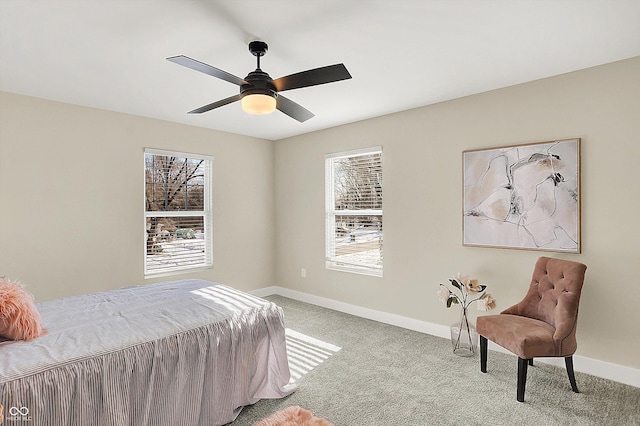 bedroom featuring light colored carpet and ceiling fan